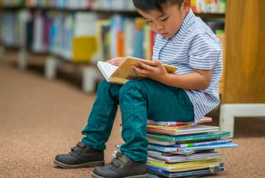 Reading On A Stack Of Books